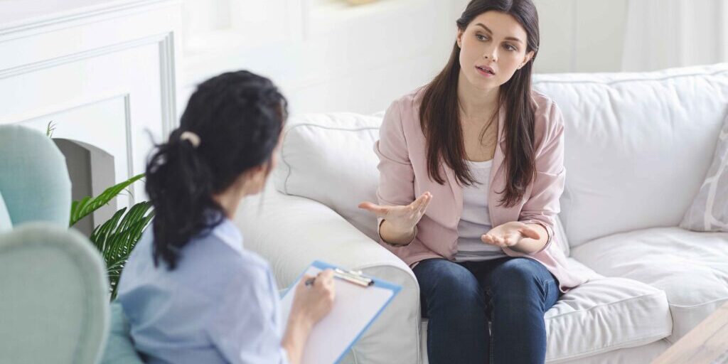 Lady talking with lady doctor Depositphotos_324503374_XL